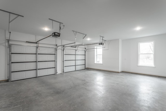 garage featuring baseboards and a garage door opener