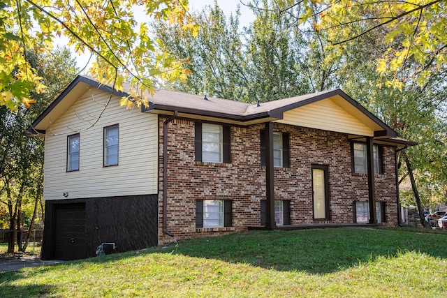 view of home's exterior featuring a yard and a garage