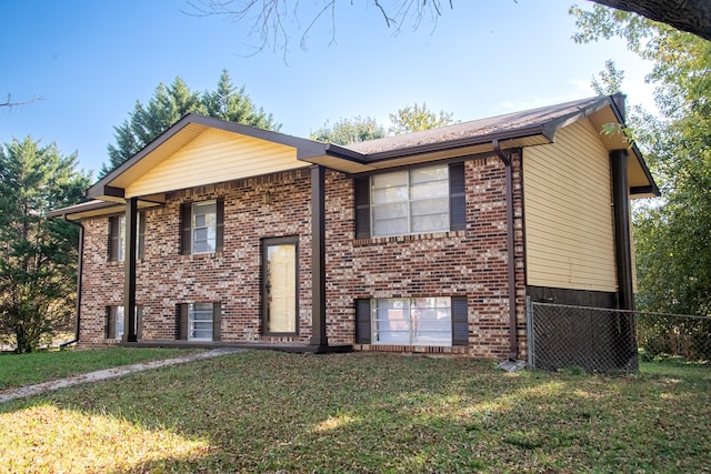 bi-level home with a front lawn