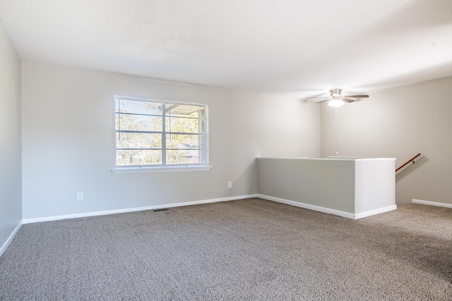 carpeted empty room with ceiling fan