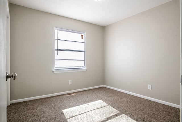 spare room featuring carpet flooring