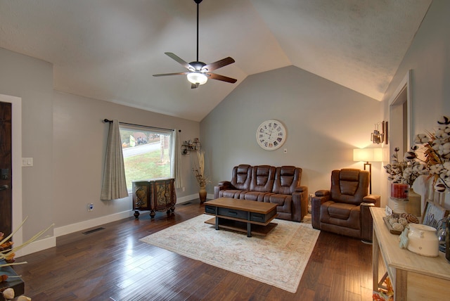 living room featuring lofted ceiling, dark wood-type flooring, and ceiling fan