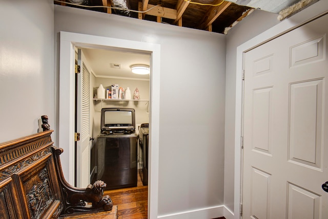 washroom featuring washer and clothes dryer and wood-type flooring