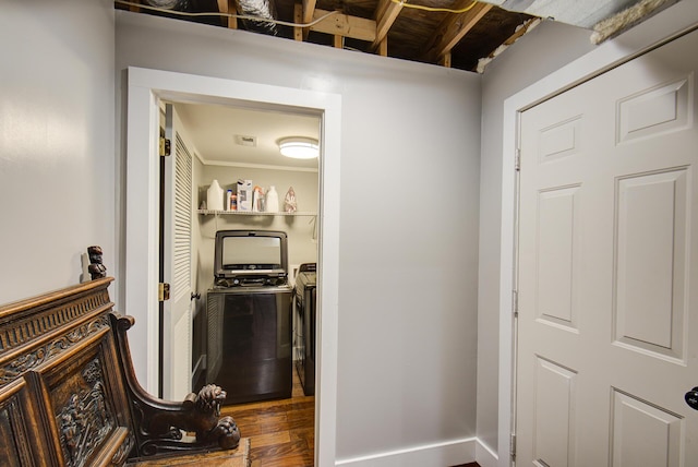 hall featuring washing machine and clothes dryer and wood finished floors