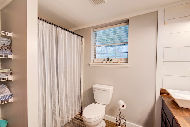 bathroom with vanity and toilet