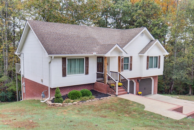 view of front of home with a garage and a front lawn