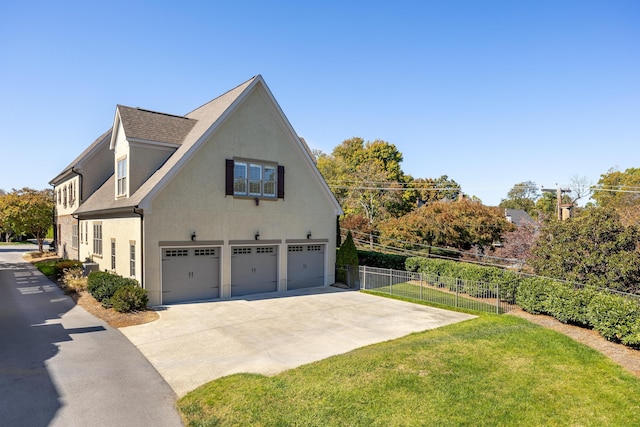 view of property exterior with a garage and a yard