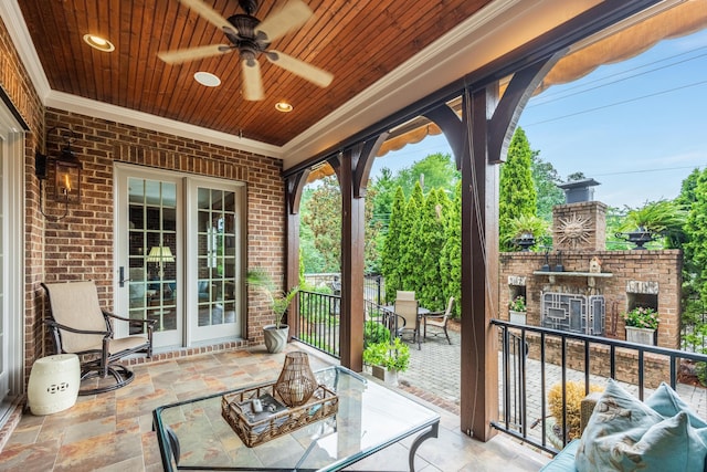 view of patio featuring ceiling fan and a bar