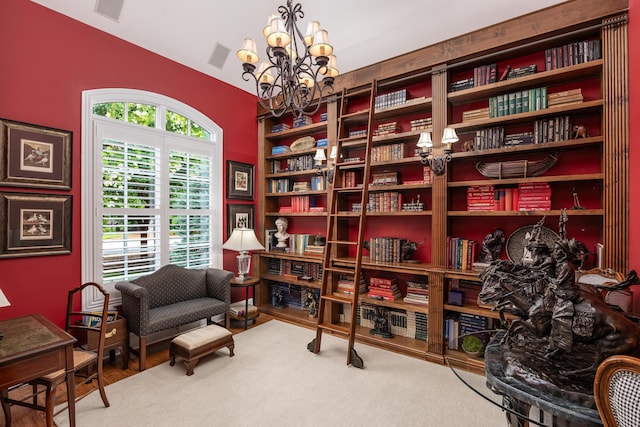 living area with vaulted ceiling and a notable chandelier