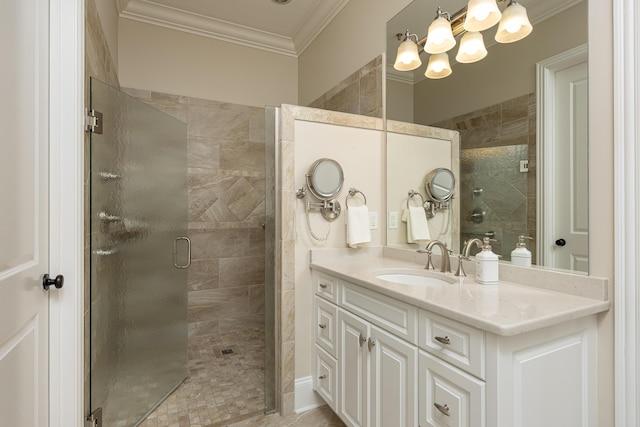 bathroom featuring an enclosed shower, vanity, and ornamental molding