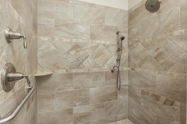 bathroom with tiled shower