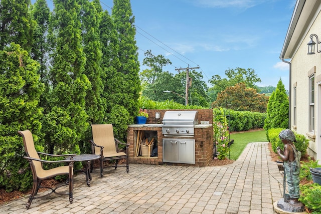 view of patio / terrace with exterior kitchen and area for grilling