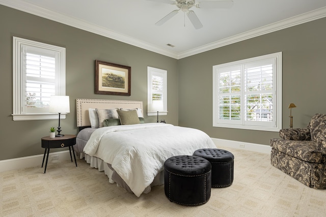 carpeted bedroom featuring ceiling fan, crown molding, and multiple windows