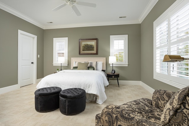 carpeted bedroom featuring ceiling fan and ornamental molding