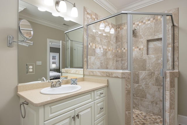 bathroom with vanity, a shower with door, and ornamental molding