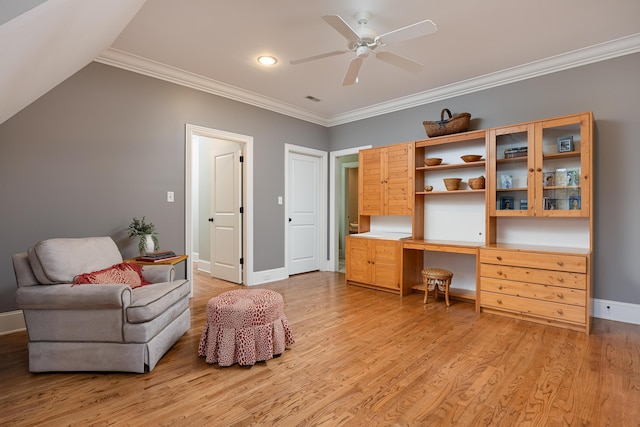 office area with light wood-type flooring, ceiling fan, and crown molding