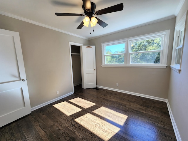 unfurnished bedroom featuring ceiling fan, crown molding, and dark hardwood / wood-style floors