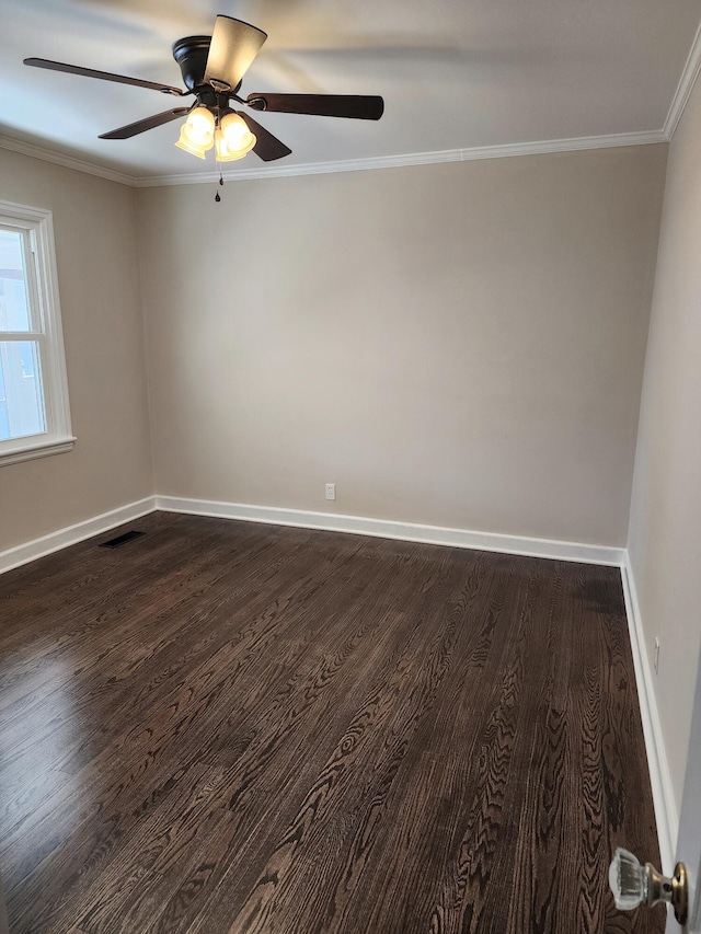 spare room featuring ceiling fan, ornamental molding, and dark hardwood / wood-style floors