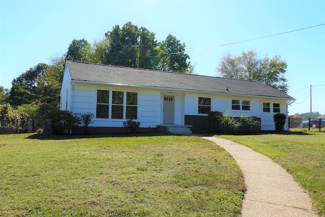 ranch-style house with a front yard