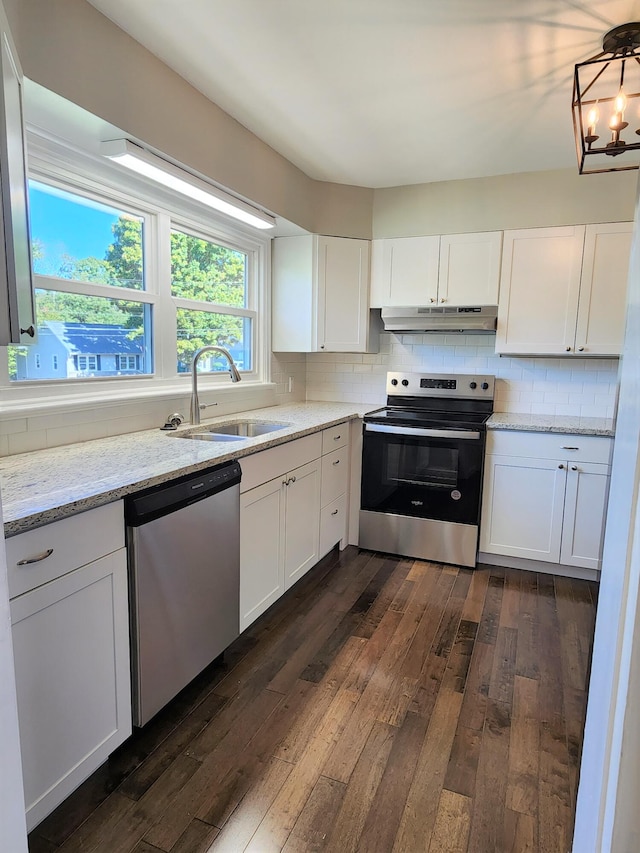 kitchen featuring white cabinets, stainless steel appliances, sink, and dark hardwood / wood-style floors