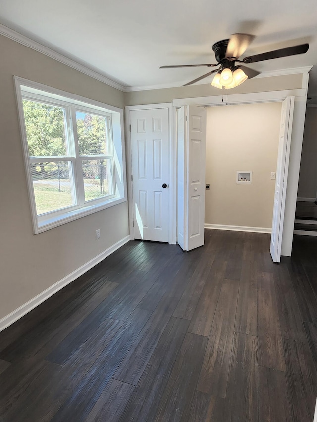 unfurnished bedroom featuring ceiling fan, crown molding, and dark hardwood / wood-style floors