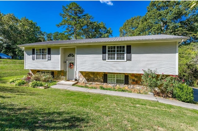 split foyer home with a front lawn