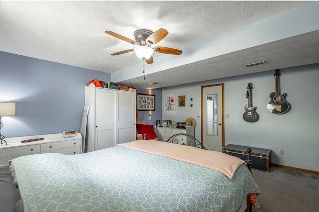 bedroom featuring carpet, a textured ceiling, and ceiling fan