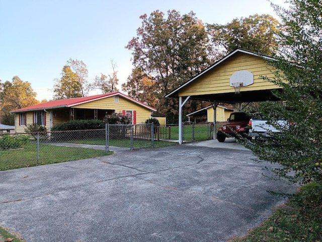 exterior space featuring a yard and a carport