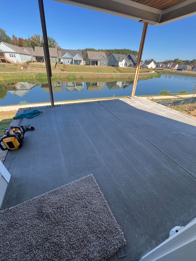 view of patio with a water view