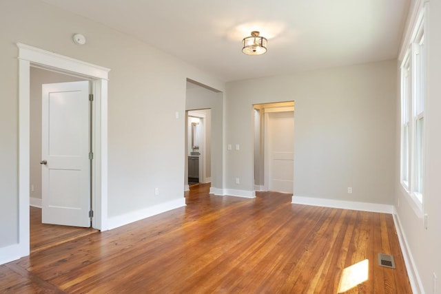 unfurnished bedroom with hardwood / wood-style floors