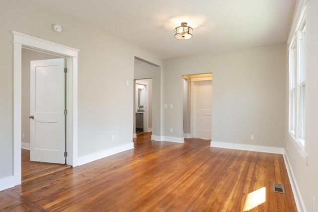 719 Federal St, Chattanooga, TN 37405 - interior space featuring multiple windows, visible vents, hardwood / wood-style floors, and baseboards