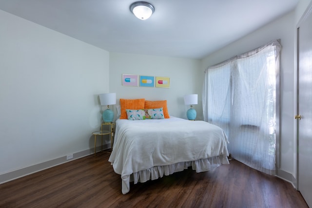 bedroom featuring dark wood-type flooring