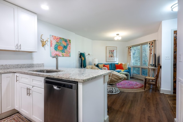 kitchen with dishwasher, dark hardwood / wood-style floors, kitchen peninsula, sink, and white cabinetry