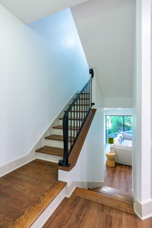 stairs with wood-type flooring