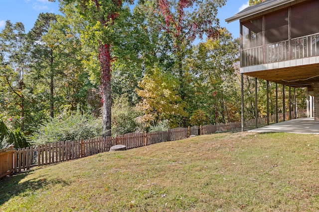 view of yard with a sunroom