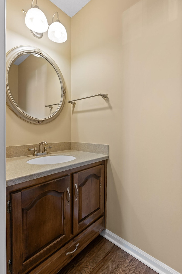 bathroom with vanity and wood-type flooring