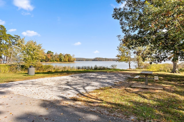 surrounding community featuring a water view