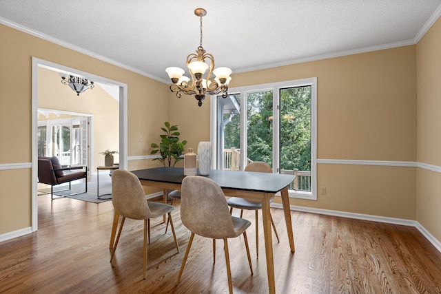 2508 Lake Dweller Ln, Hixson, TN 37343 - dining space featuring a chandelier, light wood-style flooring, and crown molding