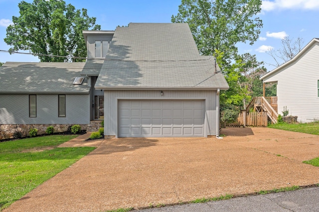 2508 Lake Dweller Ln, Hixson, TN 37343 - view of front of property with a shingled roof, concrete driveway, a front lawn, and a garage