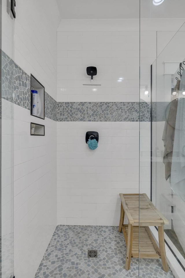 bathroom with tiled shower