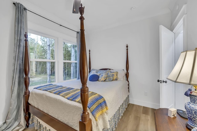 bedroom with hardwood / wood-style floors