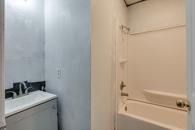 bathroom with vanity and bathing tub / shower combination