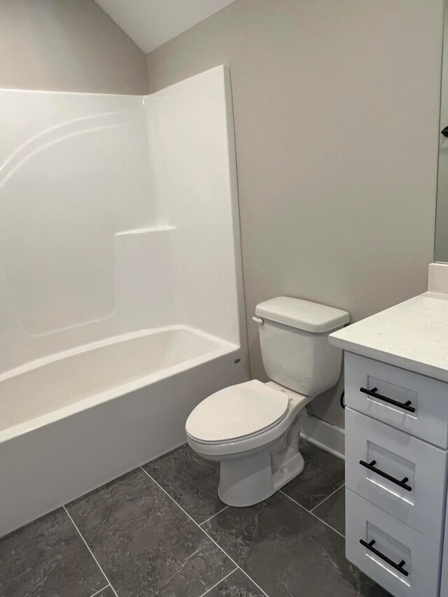 full bathroom with vanity, tile patterned floors, toilet, and shower / bath combination