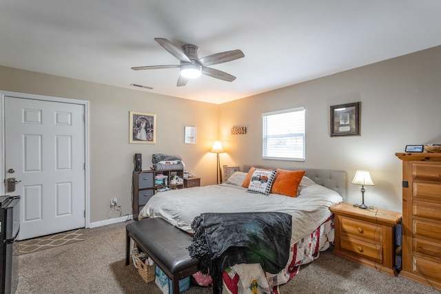 bedroom featuring light carpet and ceiling fan