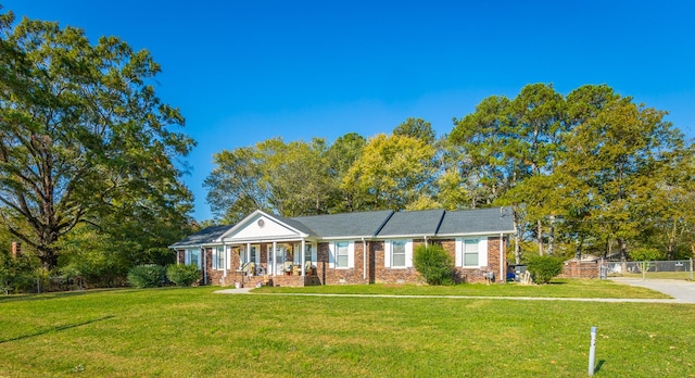 single story home featuring a front yard and a porch