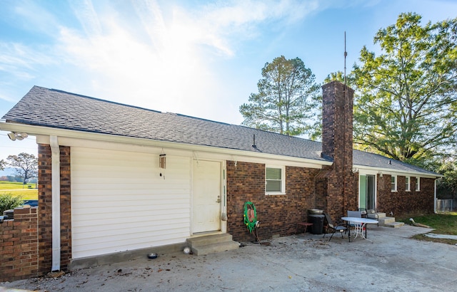 rear view of house featuring a patio
