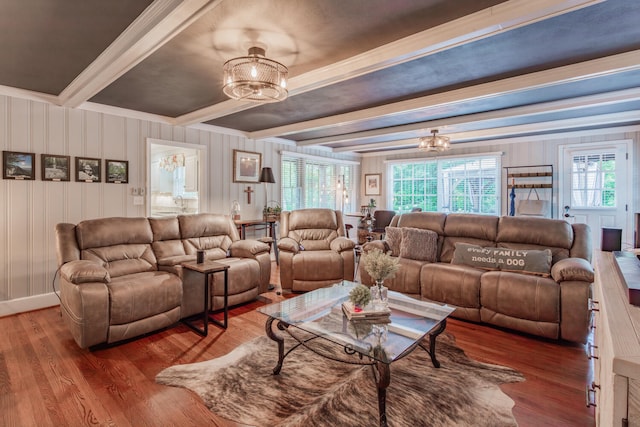 living room featuring beamed ceiling and hardwood / wood-style floors