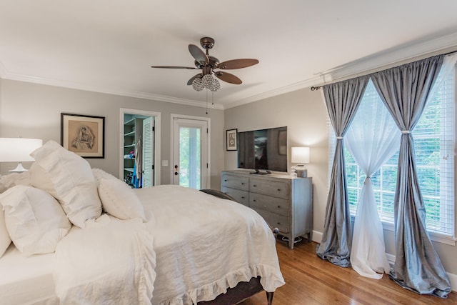 bedroom featuring ornamental molding, light hardwood / wood-style flooring, multiple windows, and ceiling fan