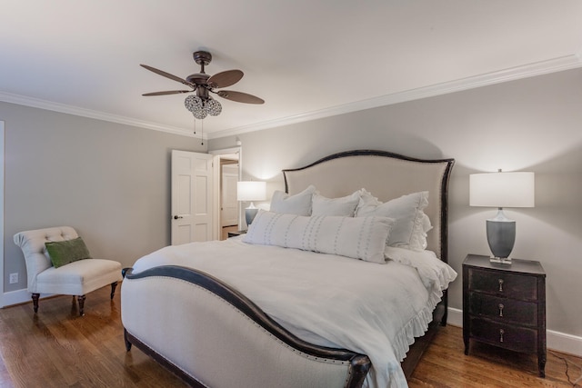 bedroom with ornamental molding, ceiling fan, and dark hardwood / wood-style flooring