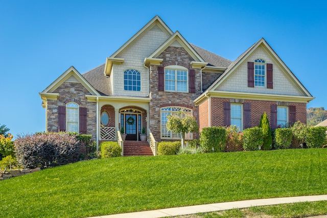 craftsman-style house with a front yard